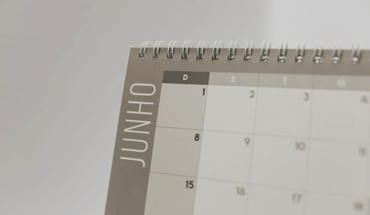Close-up view of a spiral-bound calendar showing the month of June with a date grid.
