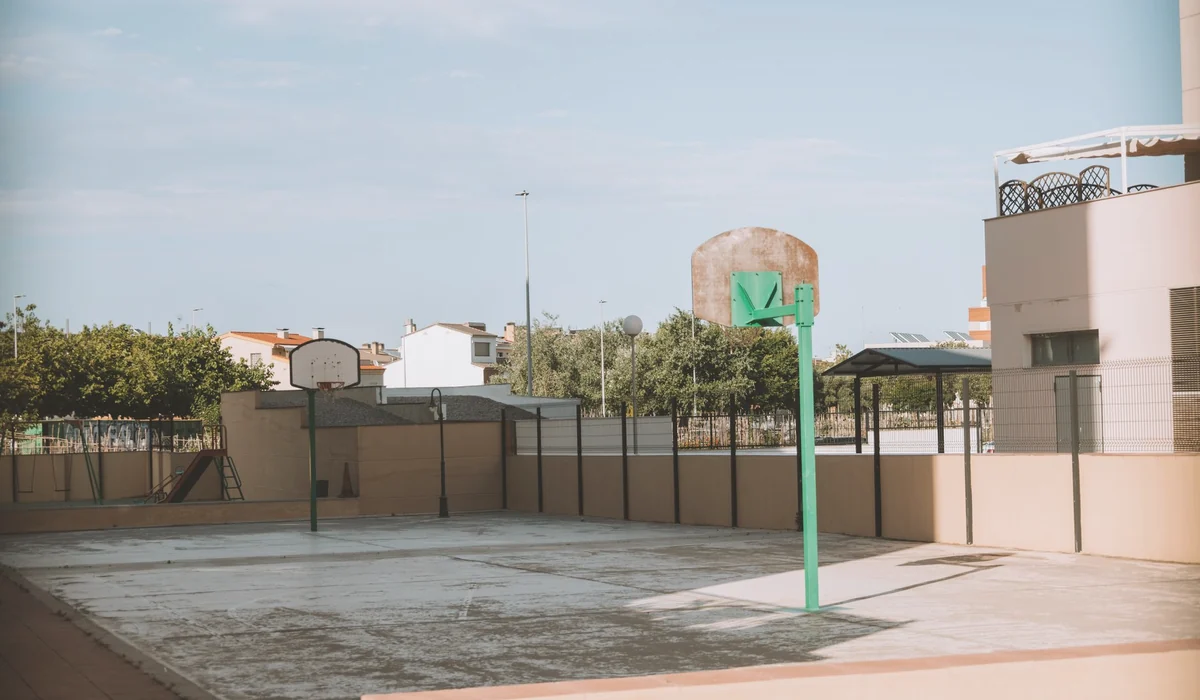 Empty basketball court in a residential outdoor area of Valencia, Spain.